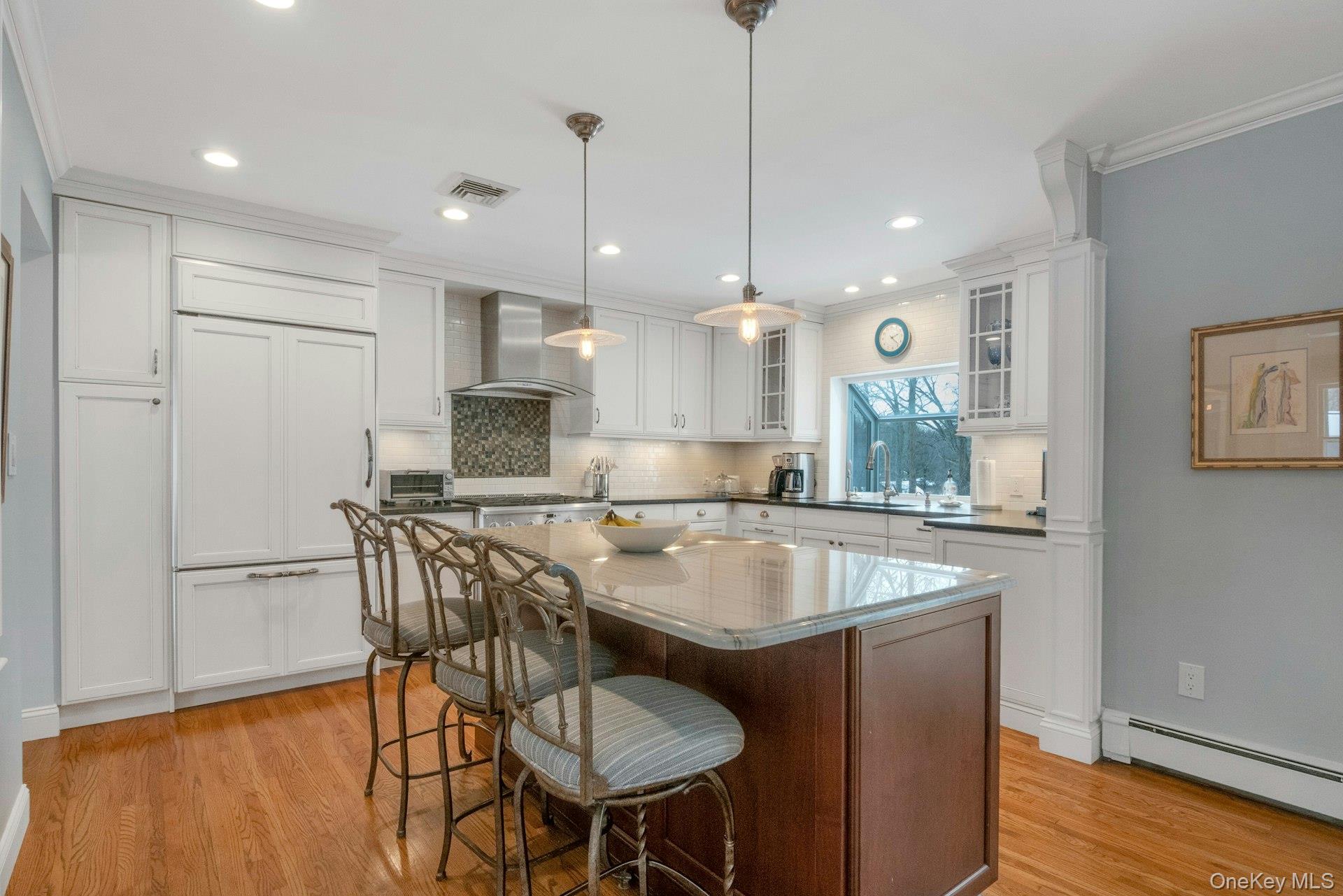 62 Whitson Road Briarcliff Manor, NY 10510 - Photo 12 of 46 Enjoy your meals sitting at the Breakfast Bar looking out the greenhouse window over the sink.