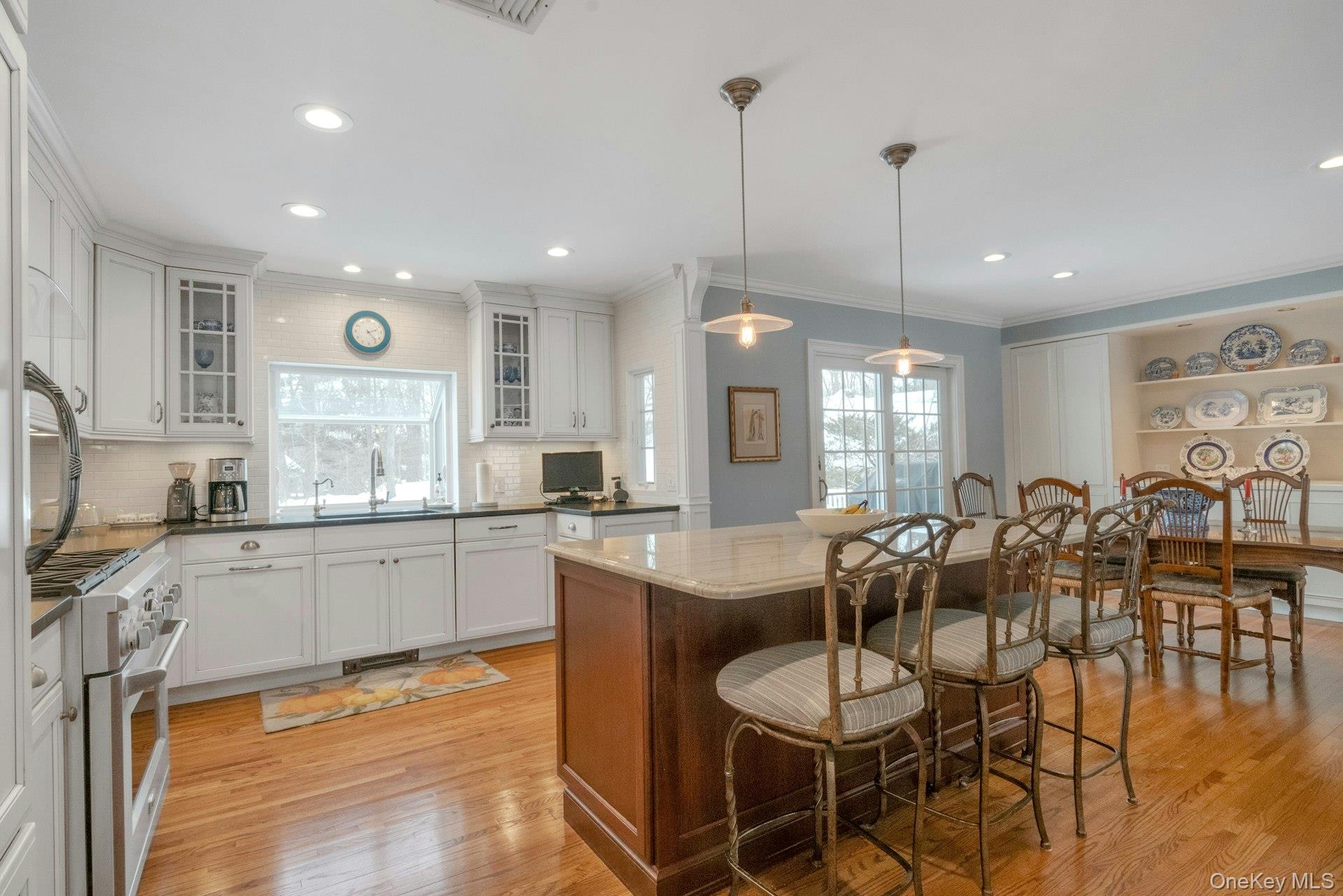 62 Whitson Road Briarcliff Manor, NY 10510 - Photo 13 of 46 Loads of custom cabinetry in the renovated Chef's Kitchen, with hardwood floors, open to DR, recessed & pendent lighting.