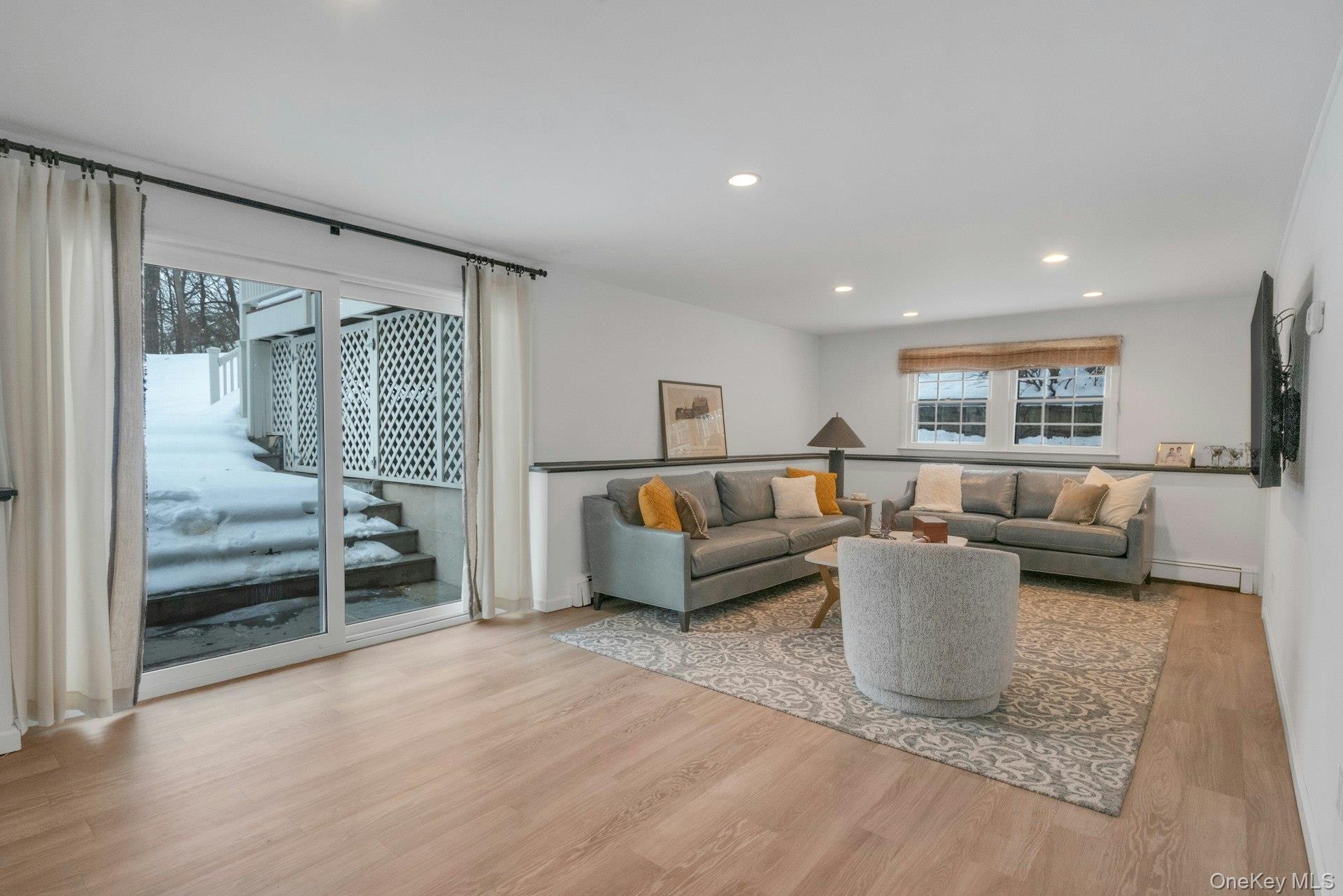 62 Whitson Road Briarcliff Manor, NY 10510 - Photo 32 of 46 New Sliding glass Doors from the walk-out Lower Level Recreation or Family Room. SGD lead to a huge rear paver Patio.