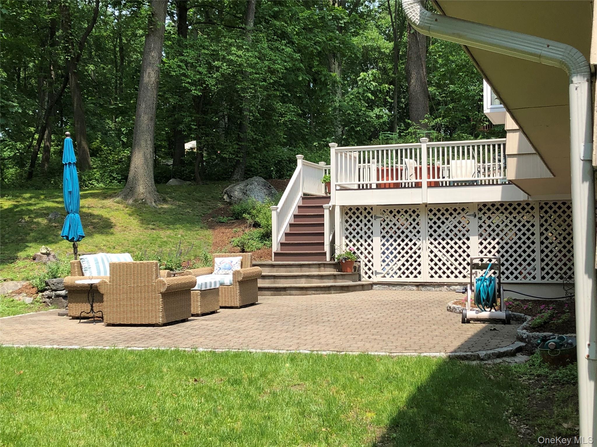 62 Whitson Road Briarcliff Manor, NY 10510 - Photo 38 of 46 Close up view of the patio & deck with large storage area below.