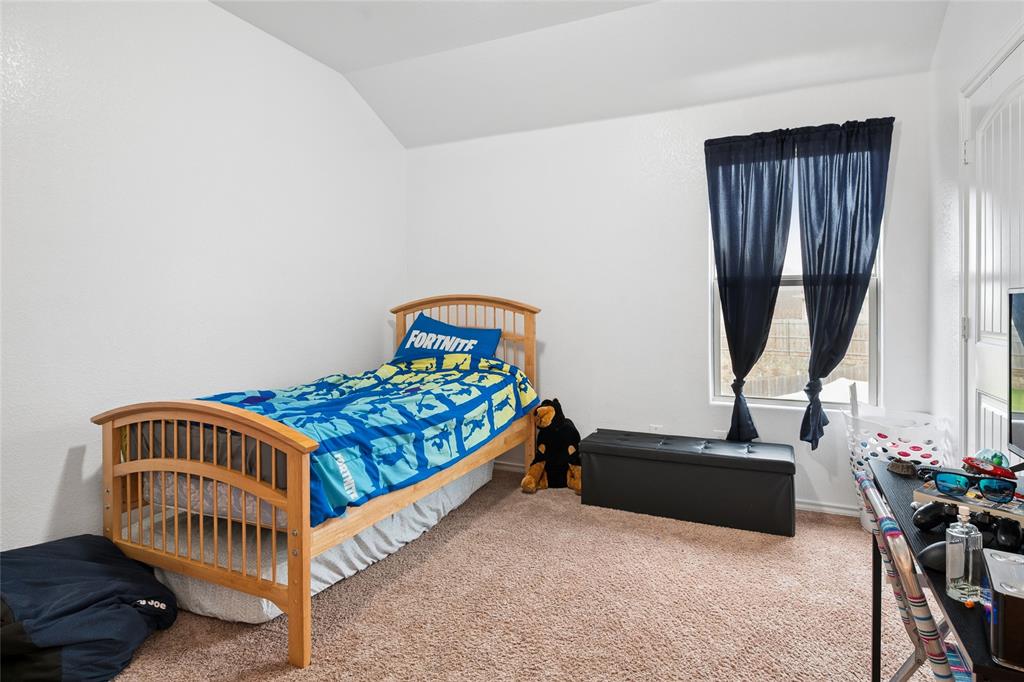 324 Fairgrounds Lane Ponder, TX 76259 - Photo 18 of 40 a bedroom with a bed and a window