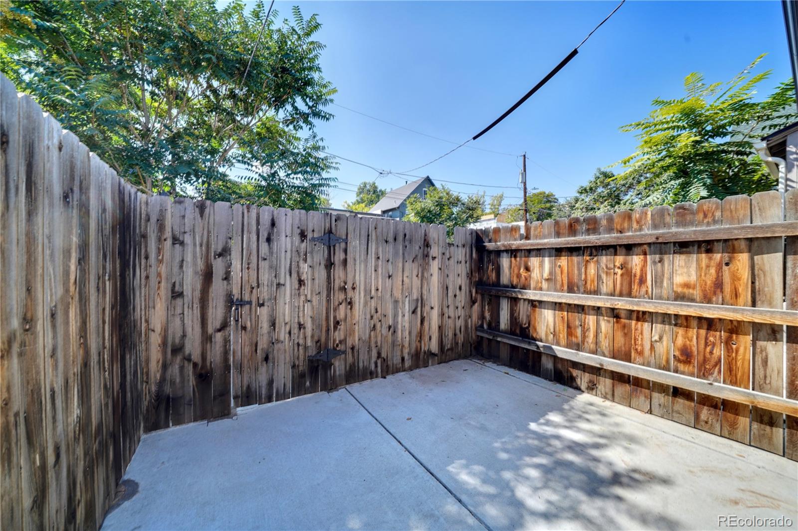 2528 West 23rd Avenue Denver, CO 80211 - Photo 17 of 21 a view of a backyard with wooden fence