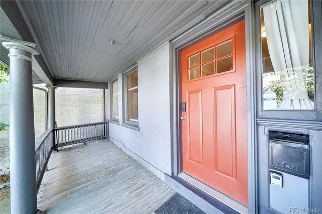 a view of a hardwood & staircase window