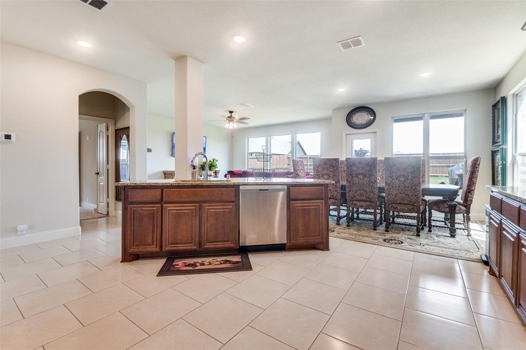 3822 Myrtle Way Kaufman, TX 75142 - Photo 15 of 39 a kitchen with stainless steel appliances a sink a counter top space and a window