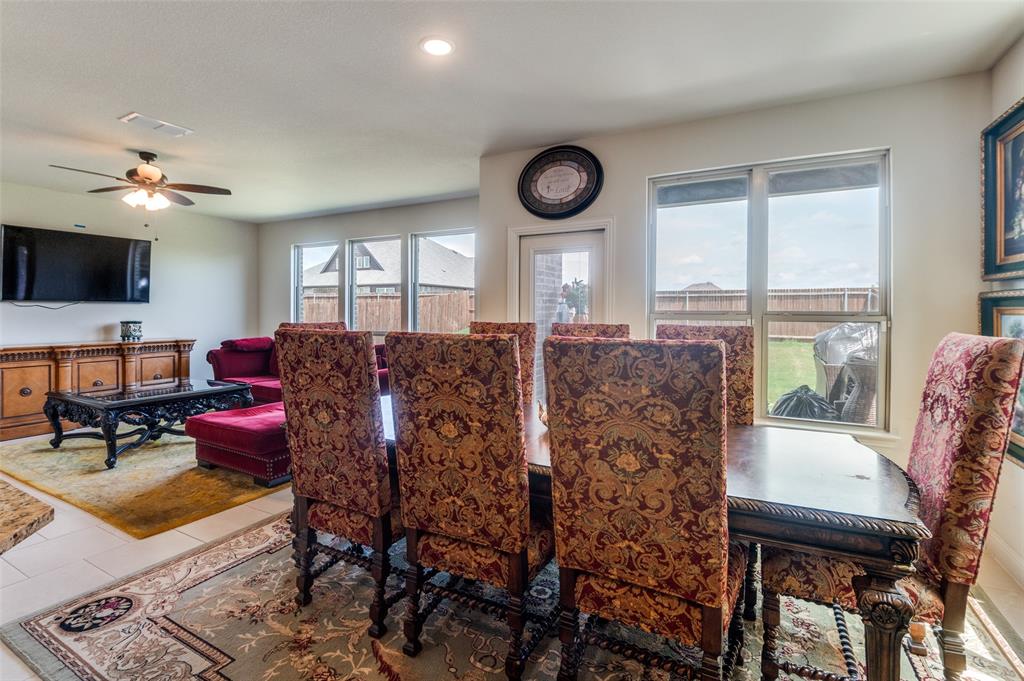 3822 Myrtle Way Kaufman, TX 75142 - Photo 16 of 39 a living room with furniture a flat screen tv and a large window