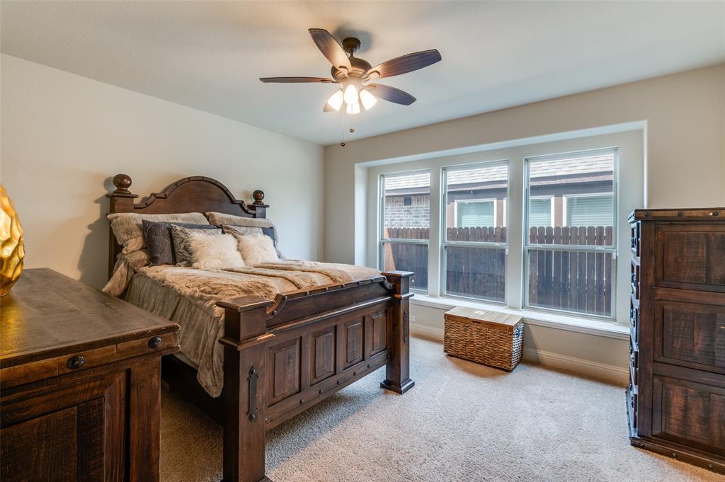 3822 Myrtle Way Kaufman, TX 75142 - Photo 18 of 39 a bedroom with a bed and a large window with the balcony view