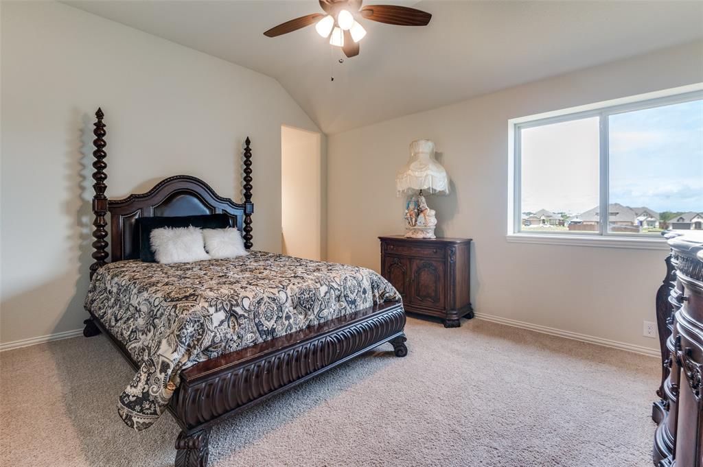 3822 Myrtle Way Kaufman, TX 75142 - Photo 30 of 39 a bedroom with a bed and a dresser with window