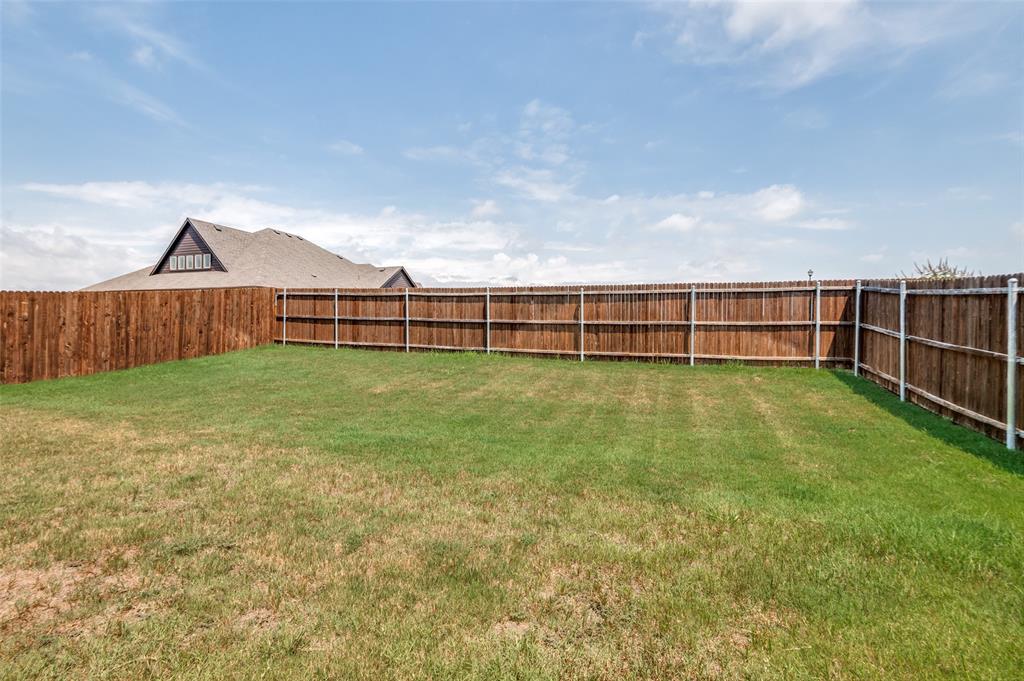 3822 Myrtle Way Kaufman, TX 75142 - Photo 35 of 39 a view of a yard with wooden fence