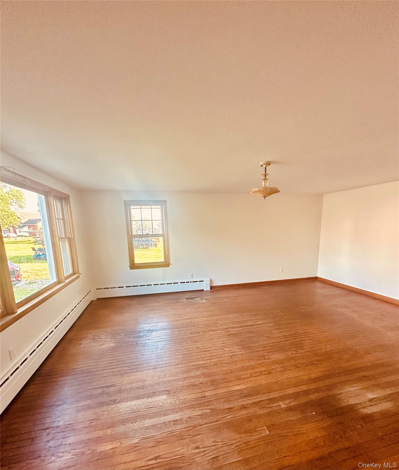3 Indiana Road Goshen, NY 10924 - Photo 7 of 13 Spacious room featuring hardwood flooring and multiple windows
