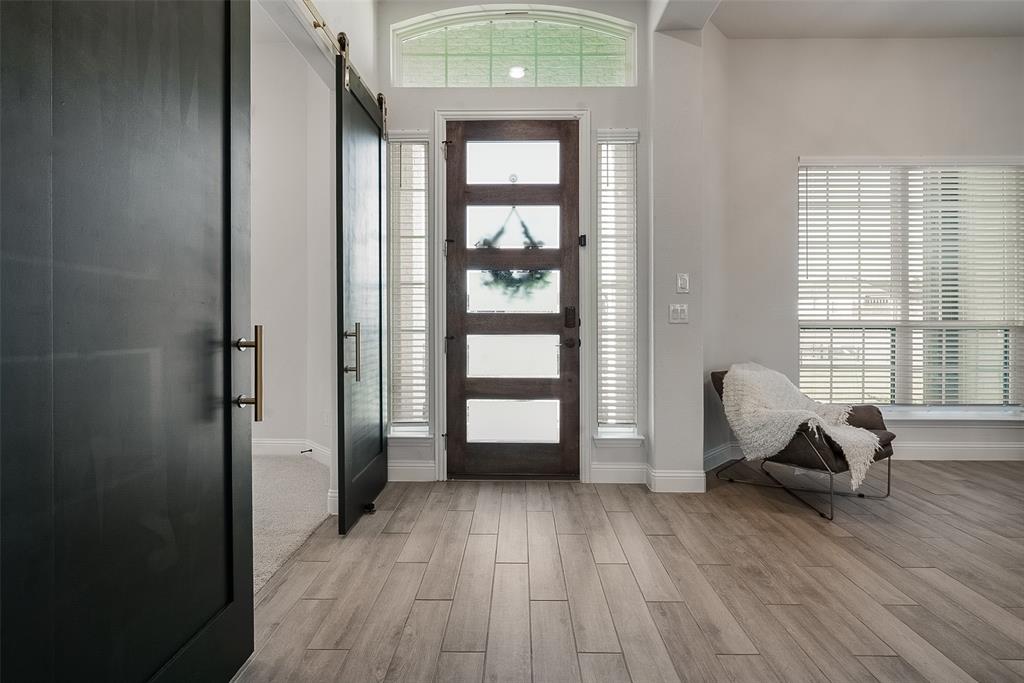1843 Granite Way Van Alstyne, TX 75495 - Photo 11 of 39 an empty room wooden floor and windows