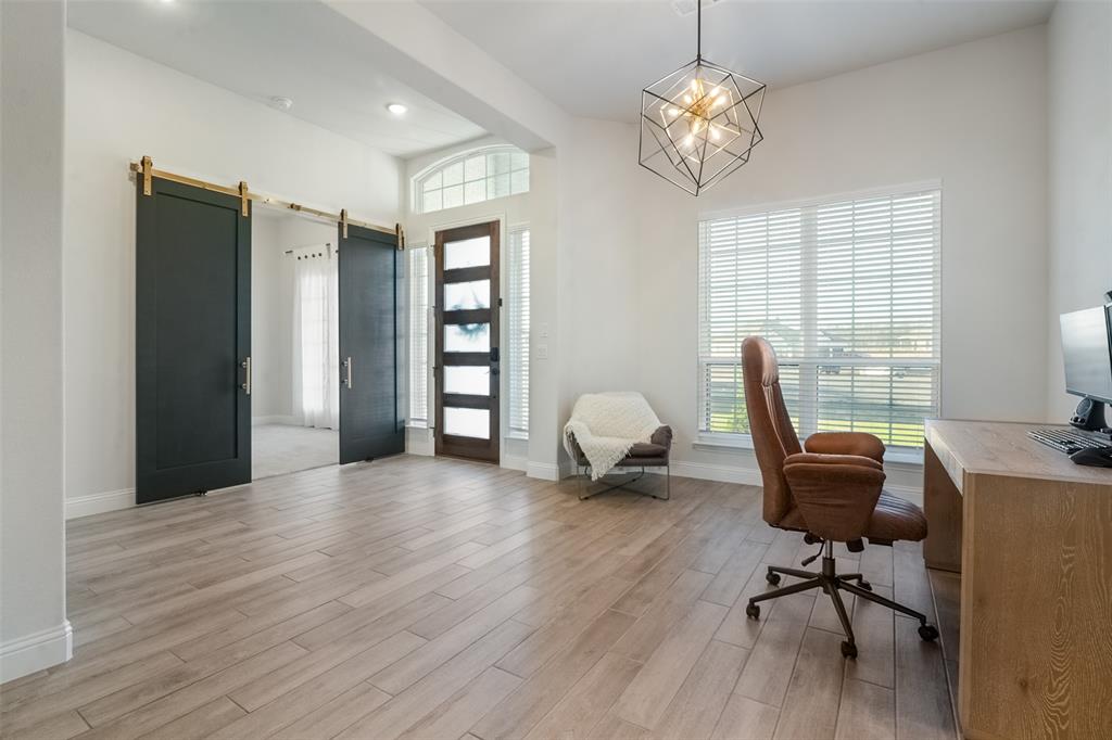 1843 Granite Way Van Alstyne, TX 75495 - Photo 13 of 39 a view of a workspace with furniture and a window