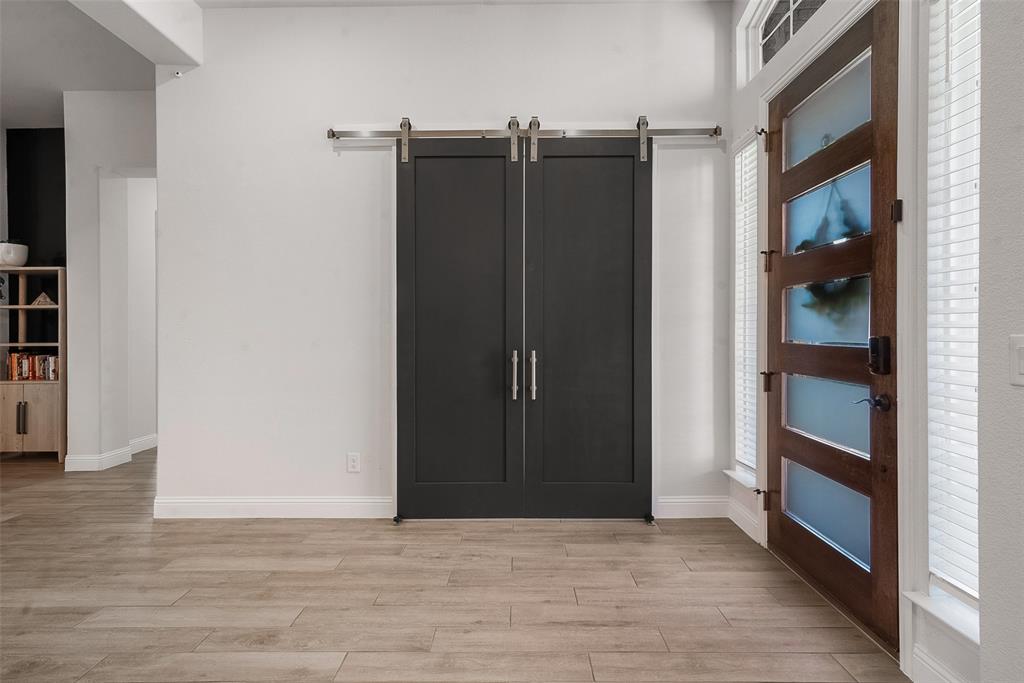 1843 Granite Way Van Alstyne, TX 75495 - Photo 16 of 39 an empty room with wooden floor and closet