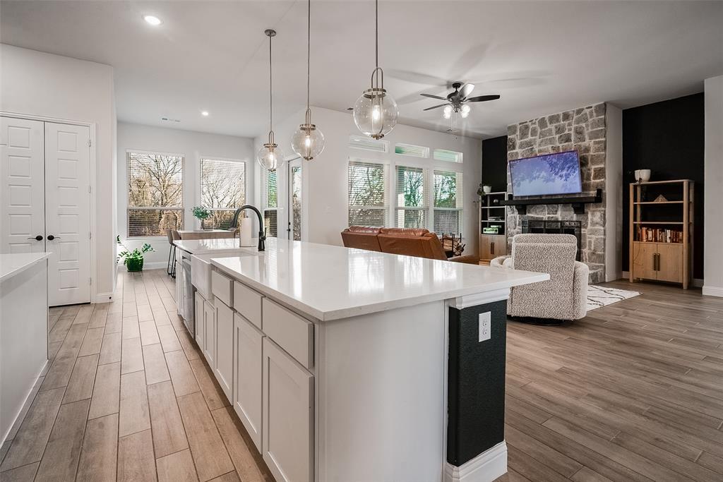 1843 Granite Way Van Alstyne, TX 75495 - Photo 21 of 39 a kitchen with counter top space and wooden floor