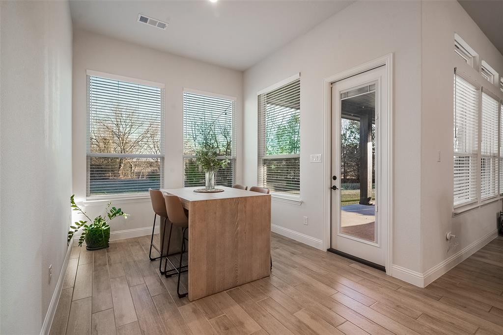1843 Granite Way Van Alstyne, TX 75495 - Photo 23 of 39 a room with furniture and wooden floor