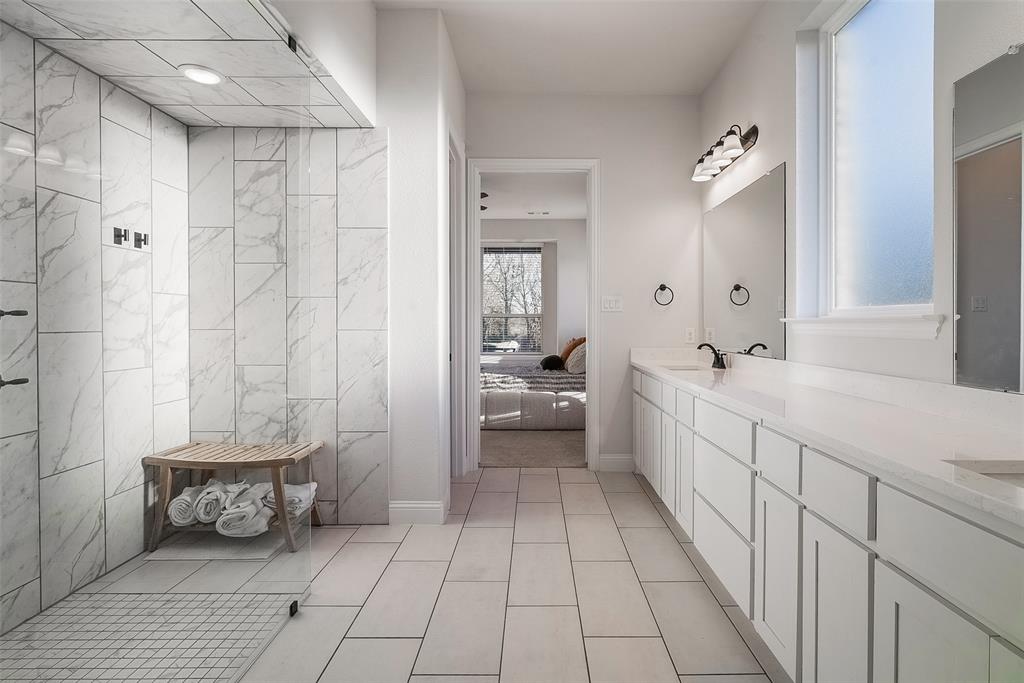 1843 Granite Way Van Alstyne, TX 75495 - Photo 29 of 39 a bathroom with a sink a toilet and shower