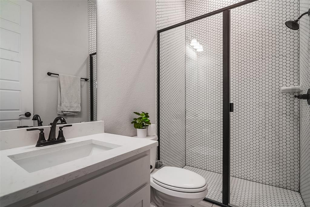 1843 Granite Way Van Alstyne, TX 75495 - Photo 33 of 39 a bathroom with a sink a toilet and shower