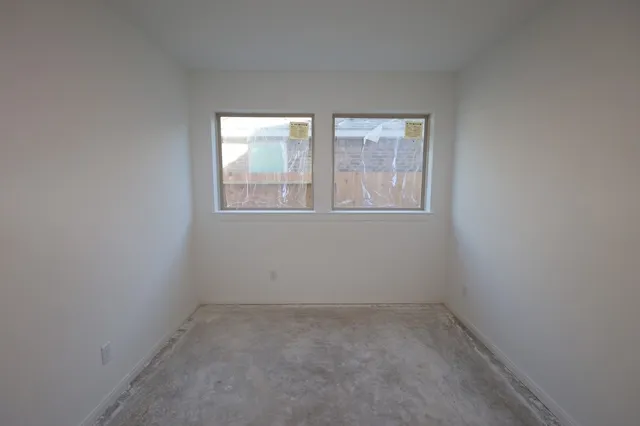 a kitchen with a table and chairs