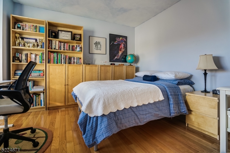 404 Brookview Court Whippany, NJ 07981 - Photo 11 of 29 a bed room with a bed and a chair