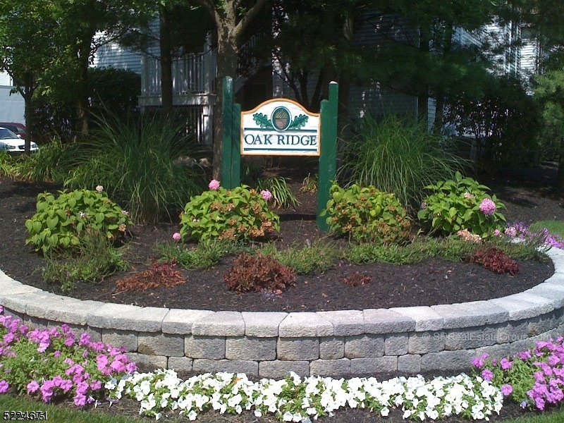 404 Brookview Court Whippany, NJ 07981 - Photo 17 of 29 a sign that is in front of flowers