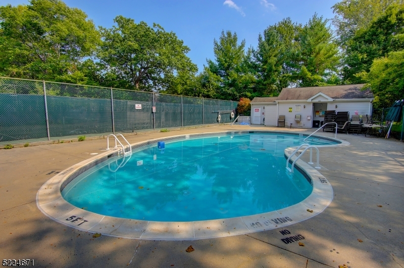 404 Brookview Court Whippany, NJ 07981 - Photo 21 of 29 a view of a swimming pool with a backyard