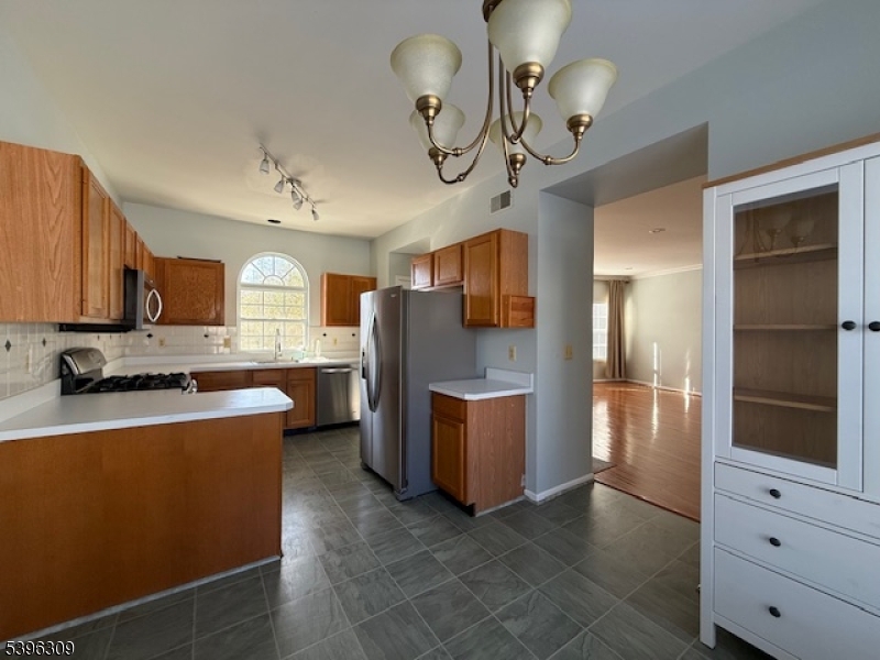 404 Brookview Court Whippany, NJ 07981 - Photo 24 of 29 a kitchen with stainless steel appliances granite countertop a refrigerator a oven a sink and dishwasher