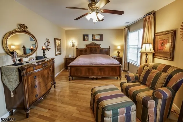 a living room with furniture a mirror and a window