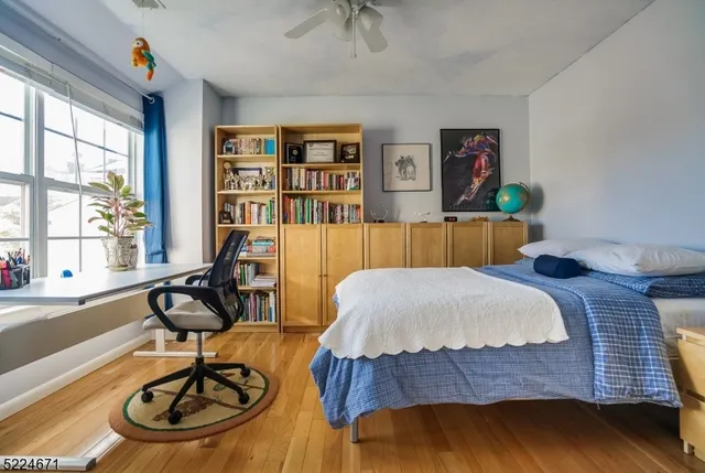 a bedroom with furniture and a window