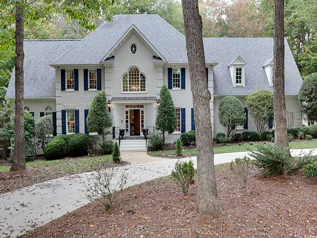 445 Swans Mill Crossing Raleigh, NC 27614 - Photo 1 of 17 Front view shows a well maintained painted brick home with mature harwoods/landscaping and features a circular drive in addition to 3-car side entry garage/driveway.