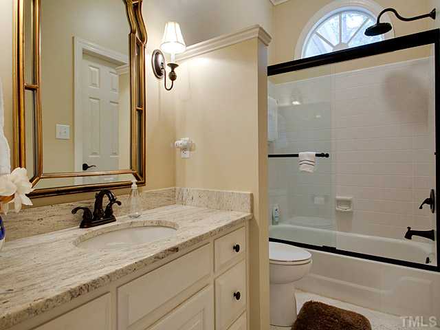 445 Swans Mill Crossing Raleigh, NC 27614 - Photo 12 of 17 Private Guest bath downstairs, beautiful granite counters and updated fixtures.