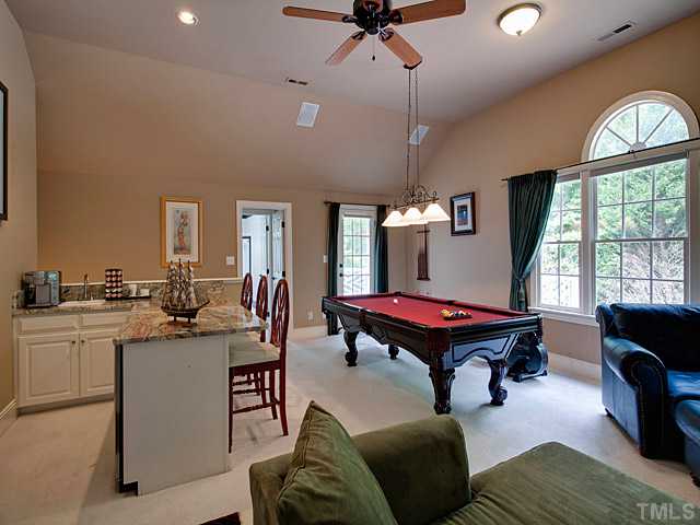 445 Swans Mill Crossing Raleigh, NC 27614 - Photo 10 of 17 Use your imagination for this HUGE Bonus Room! Features an upgraded granite bar area with refrigerator and bar sink. French door leads to Terrace above 3rd garage.