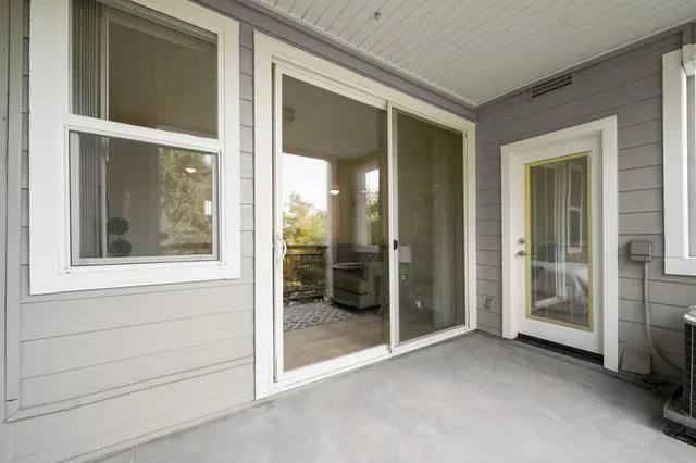 a view of a balcony with chairs