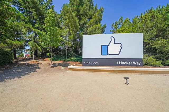 a view of a brick building next to a road