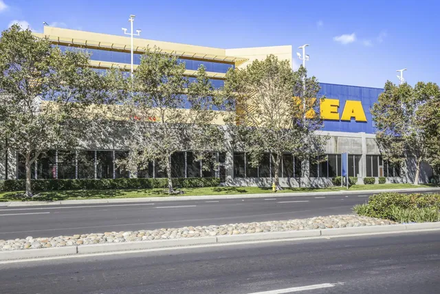 a front view of a building with street sign