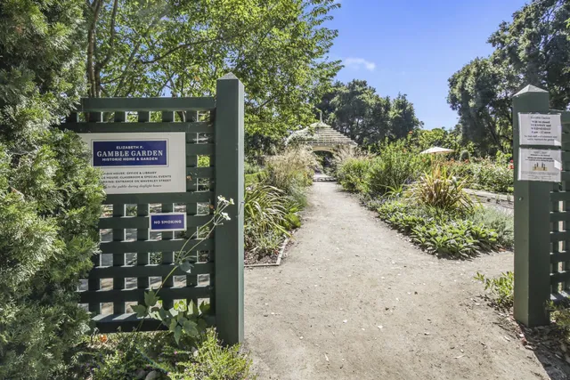 a outdoor view of a building with traffic signal lights