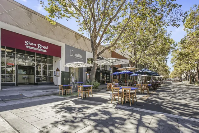 a view of a building with sitting area