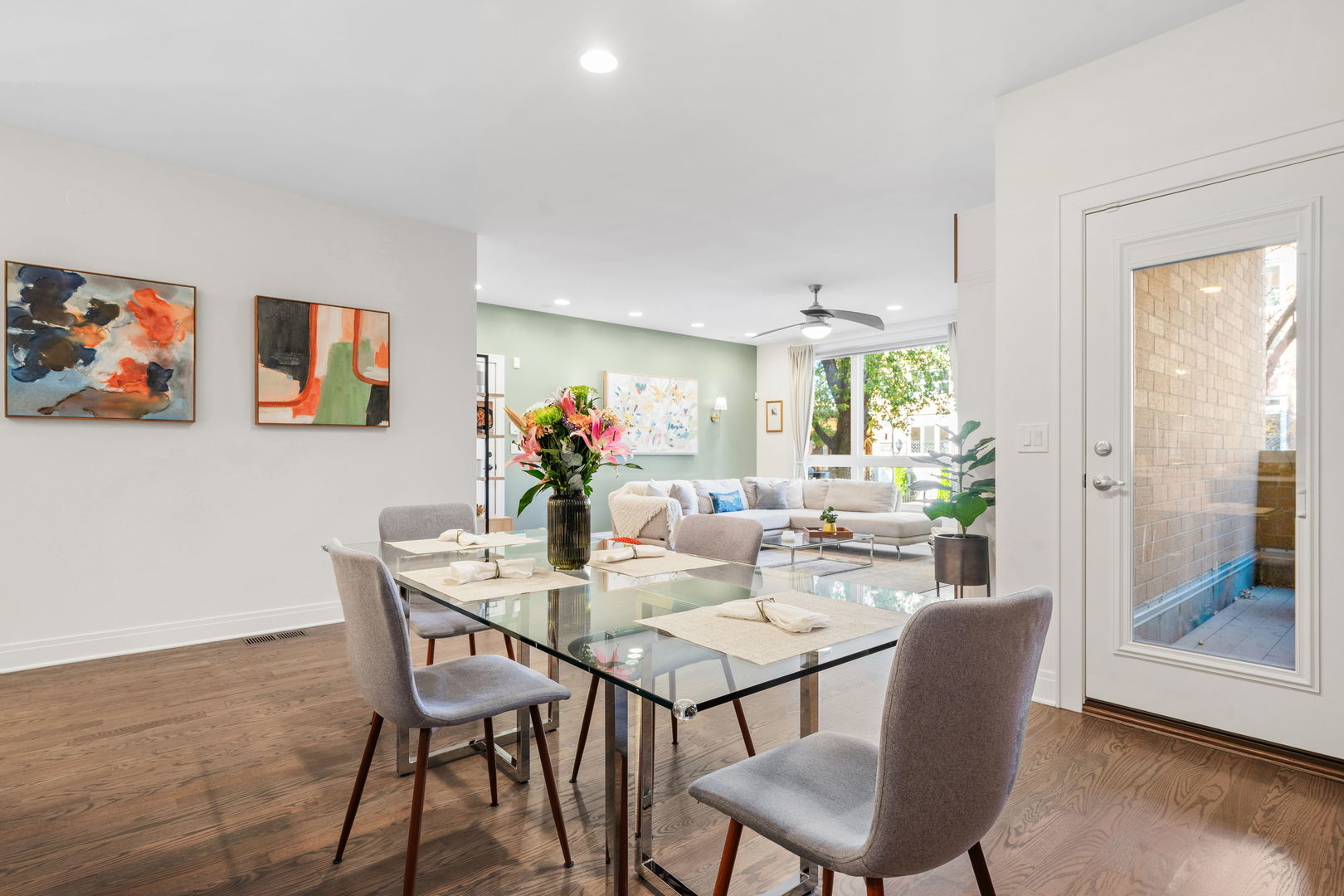 933 West George Street, Unit 1N Chicago, IL 60657 - Photo 12 of 30 a view of a dining room with furniture and wooden floor