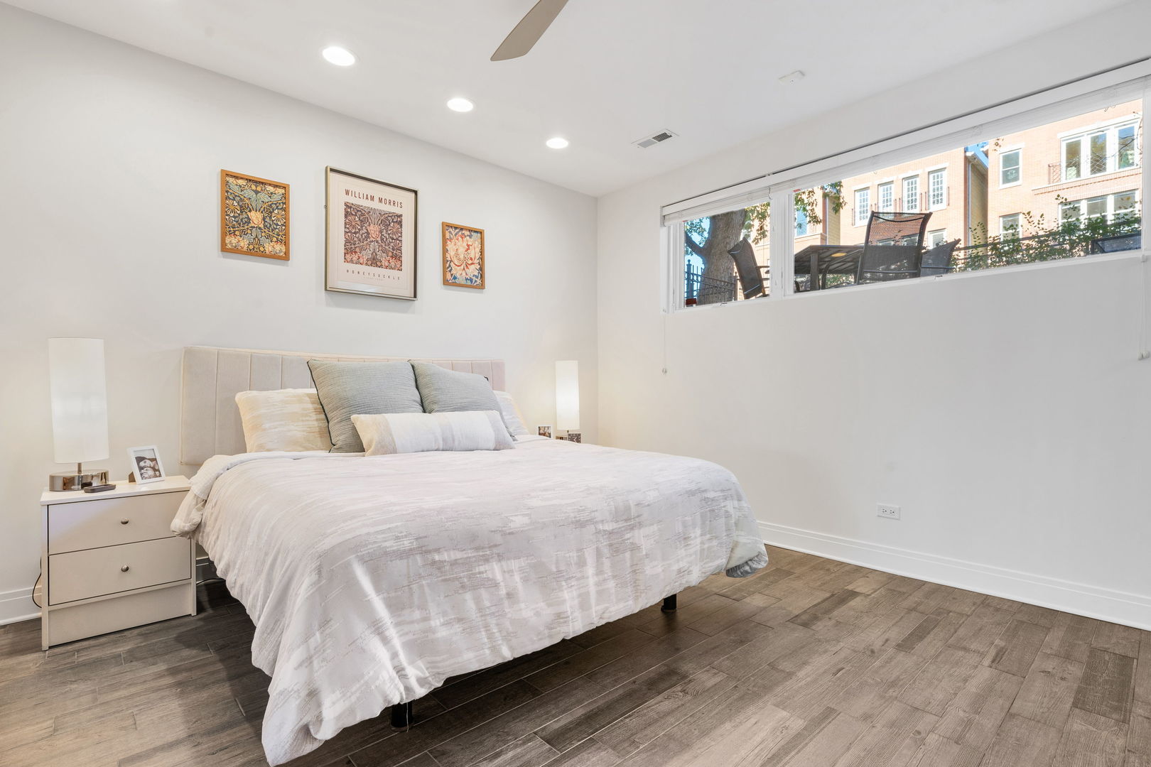 933 West George Street, Unit 1N Chicago, IL 60657 - Photo 17 of 30 a bedroom with a large bed and a window