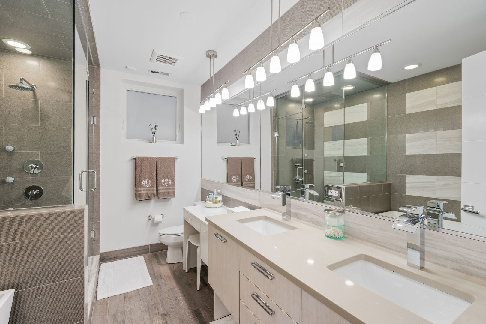 933 West George Street, Unit 1N Chicago, IL 60657 - Photo 20 of 30 a bathroom with a sink double vanity and a shower