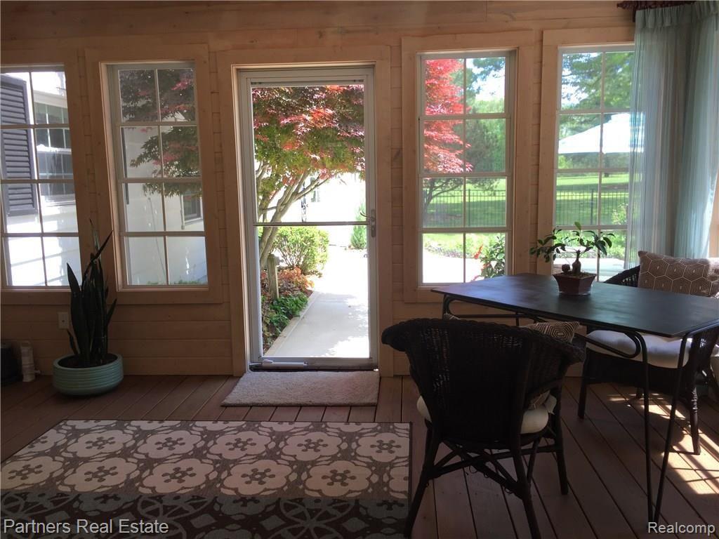 4400 Golf Club Road Howell, MI 48843 - Photo 15 of 68 Seasonal Sunroom overlooking pool and patio