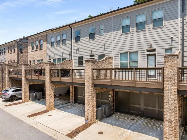 a view of a balcony with chairs and table