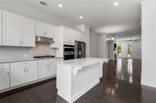 a large kitchen with cabinets