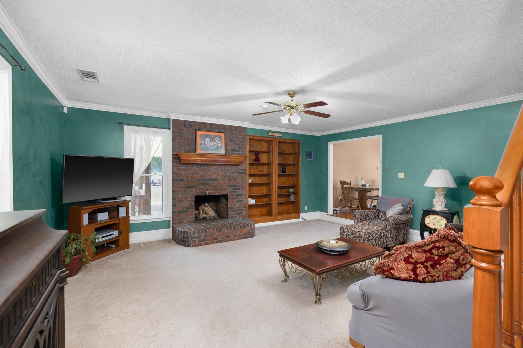 8539 Campground Road Drummonds, TN 38023 - Photo 6 of 38 a living room with furniture and a fireplace