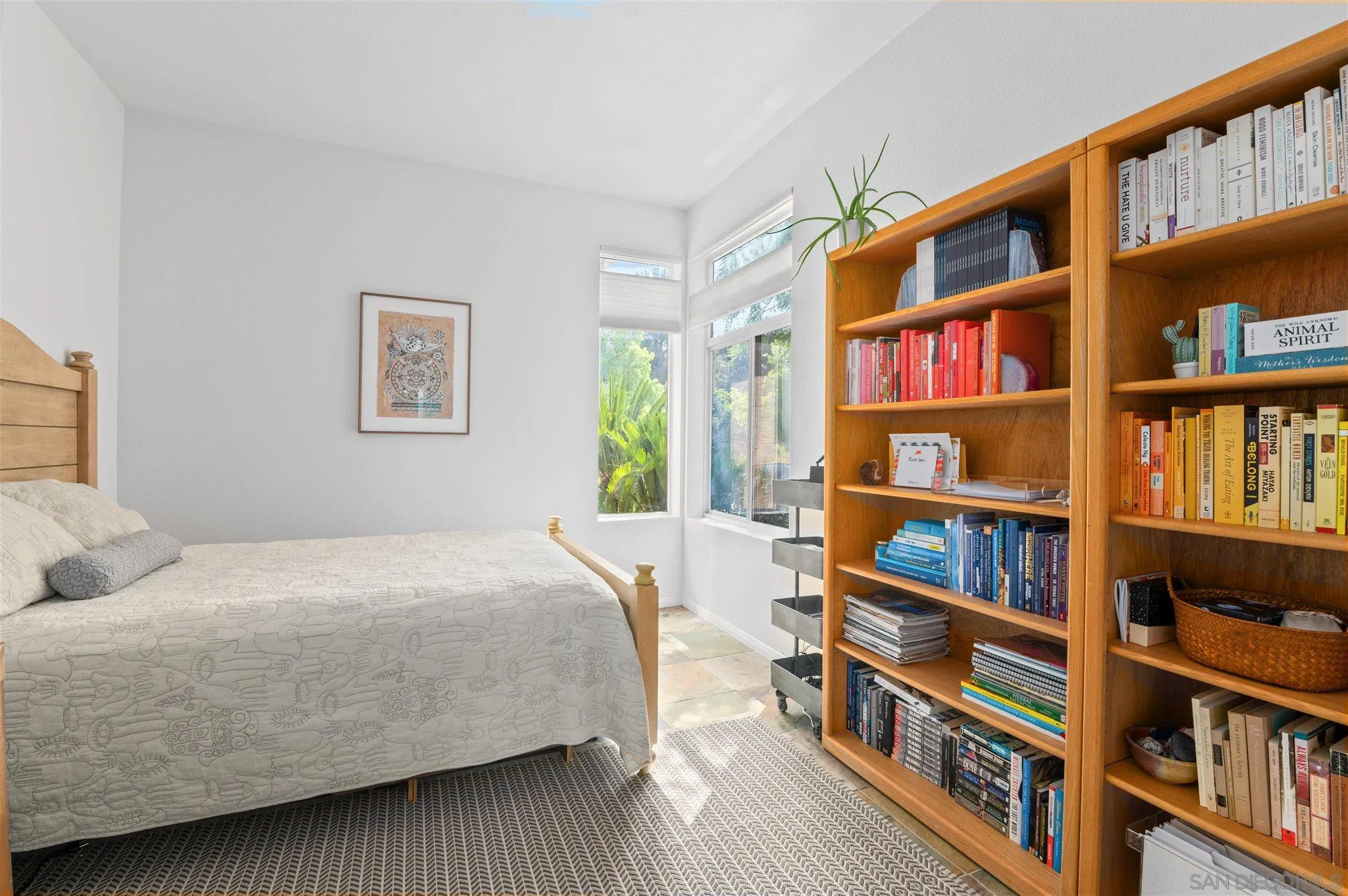 798 Windridge Circle San Marcos, CA 92078 - Photo 15 of 31 a bedroom with bed book shelf and a book shelf