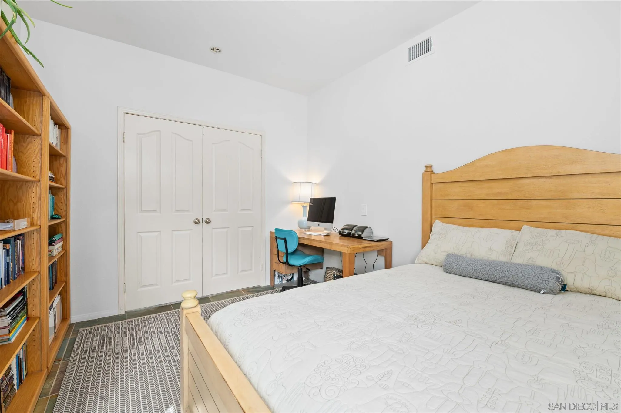 798 Windridge Circle San Marcos, CA 92078 - Photo 16 of 31 a bedroom with a bed and a cabinets