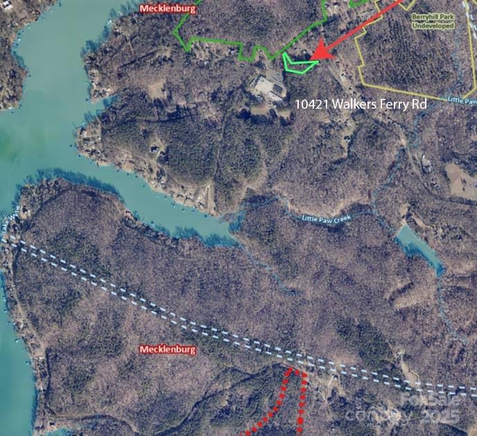 a picture of water view with large trees