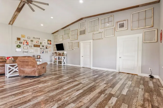a spacious bedroom with a bed and furniture