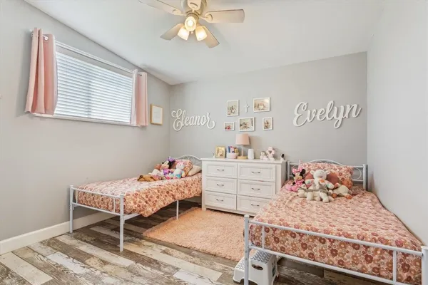 a bedroom with a bed and a book shelf