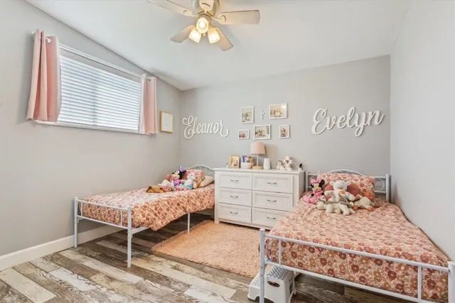 a bedroom with a bed and a book shelf