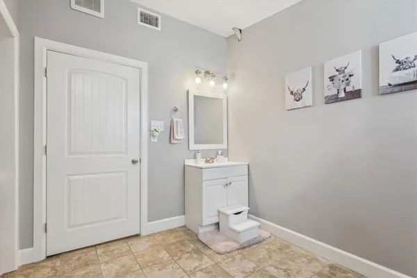 a bathroom with a toilet sink and shower