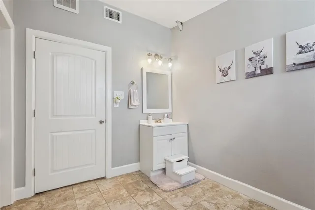 a bathroom with a toilet sink and shower
